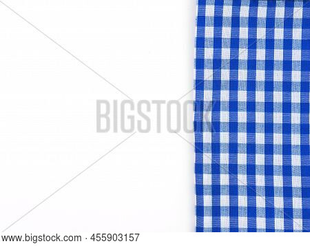 Top View, Close-up Of Blue And White Checkered Fabric Or Napkin On White Table Background. Concept K