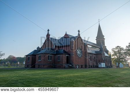Merksplas, Belgium, April 27th, 2022, The Chapel In Merksplas Colony In The Bright Sunrise Light . H