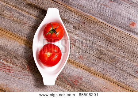Two Ripe Red Tomatoes In A Dish