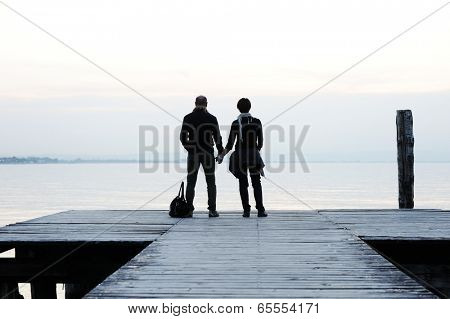 Lovely couple on a sea dock