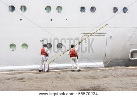Worker Renovate The Ship's Side