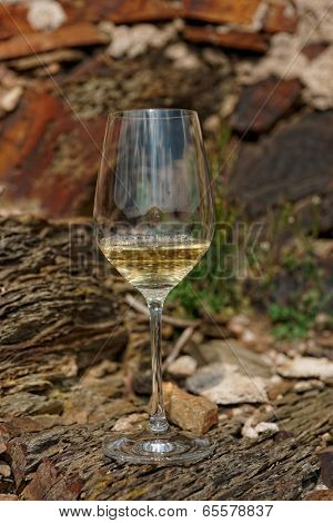 Glass of Riesling wine on a slate rock