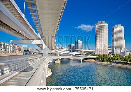 Rainbow Bridge and Sumida River in Tokyo, Japan. This landmark bridge carries many transit lines, as well as vehicle traffic.
