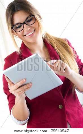 Young Smiling Woman Using Digital Tablet. Isolated On White.