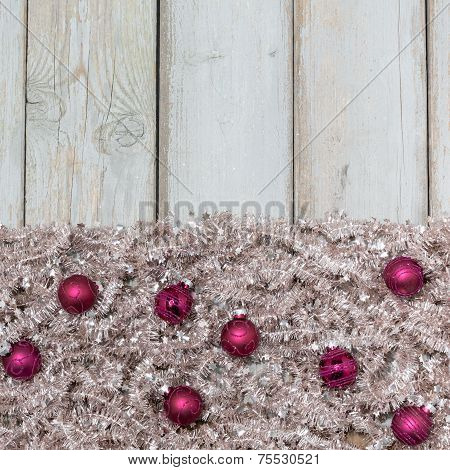 Purple Christmas Balls On Silver Tree Garland .
