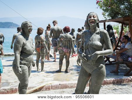 SULTANIYE, TURKEY - JULY 05, 2015:  People are taking a mud bath.