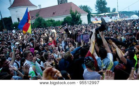 BONTIDA, ROMANIA - JUNE 27, 2015:Crowd surfing of Barry Ashworth from Dub Pistols at Electric Castle Festivall, one of the biggest music festivals in Romania