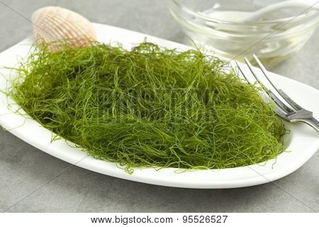 Dish with fresh filamentous green algaeas a side dish