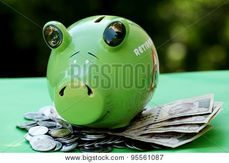 Piggy Bank With Sunset Light - Money Concept