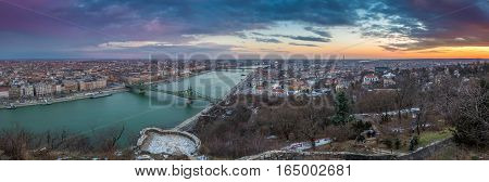 Budapest Hungary - Panoramic skyline view of the city of Budapest with River Danube Szabadsag Bridge and Gellert Bath taken from Gellert Hill at sunset