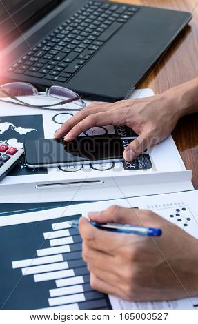 Business Workers Discussing Digital Graphs And Diagrams Indicating Progres.