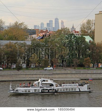 Moscow Russia - September 27 2015: people are riding in ferry by Moscow river in the center of Moscow Russia