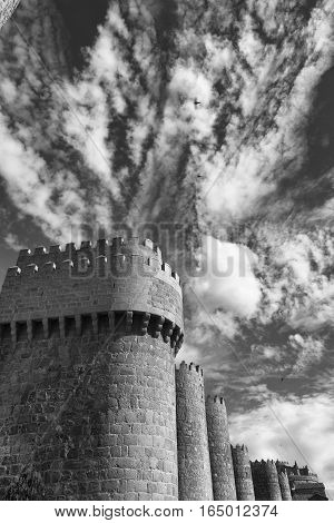 Avila (Castilla y Leon Spain): the famous medieval walls surrounding the city. Black and white