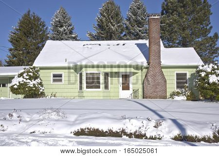 Family home and snow covered ground Gresham Oregon.