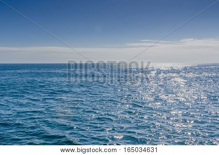 Blue sea with sunlight reflected on it