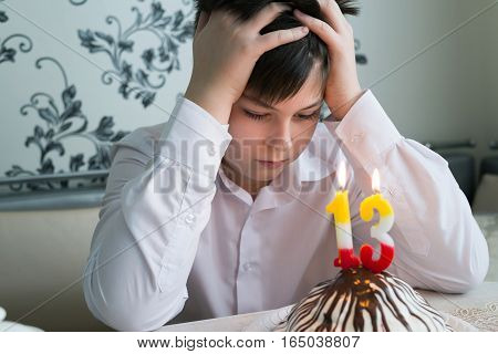 Upset teenager alone marks the 13th birthday