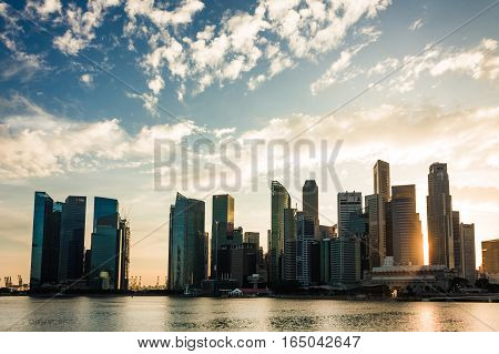 Singapore - January 07 2017: Singapore Cityscape Financial building with Dramatic Cloud in Marina Bay area Singapore Golden Hour Urban Dusk