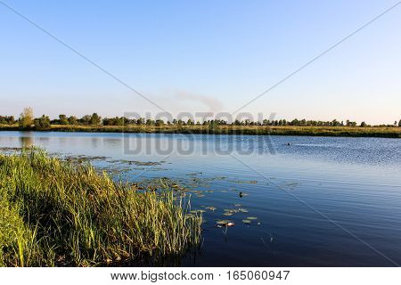 Beautiful blue lake in the village. pure water