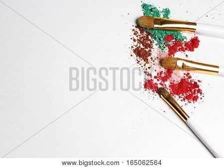Makeup highlighter, make-up on Valentine's Day, shadow and brushes for make-up, make-up artist for the tools.