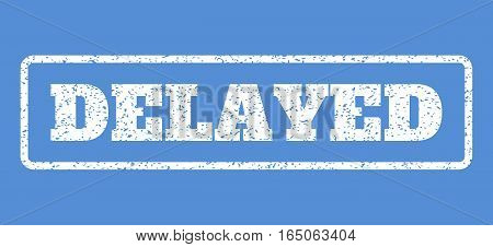 White rubber seal stamp with Delayed text. Vector tag inside rounded rectangular frame. Grunge design and unclean texture for watermark labels. Horisontal sign on a blue background.