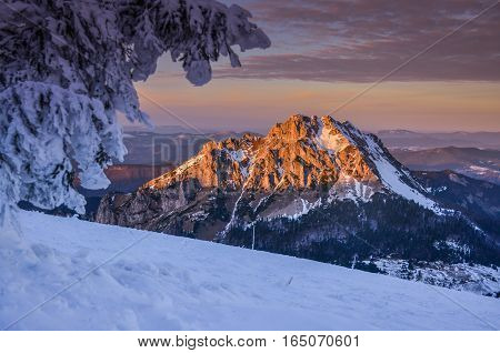 Fantastic evening winter landscape. Dramatic overcast sky.