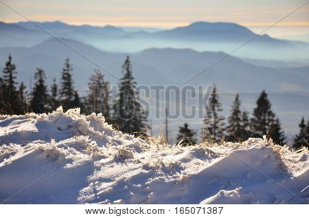 Fantastic evening winter landscape. Dramatic overcast sky in the mountains.