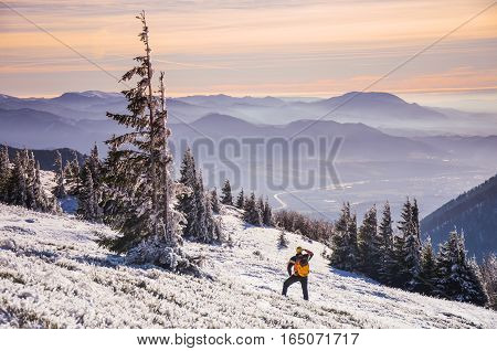 Fantastic evening winter landscape. Dramatic overcast sky in the mountains.