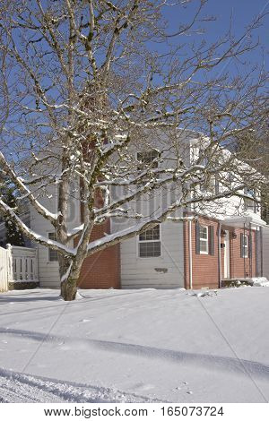 Family home and snow covered ground Gresham Oregon.