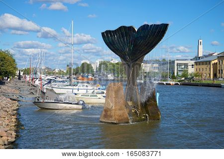 TURKU, FINLAND - AUGUST 27, 2016: Fountain "Harmony" in the background of the river Aura sunny August day