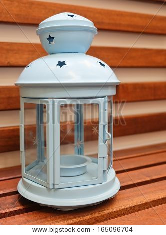 Decorative Light Blue Vintage Lantern on A Wooden Table Used to Illuminate Surrounding Space for Decorations and Atmosphere.