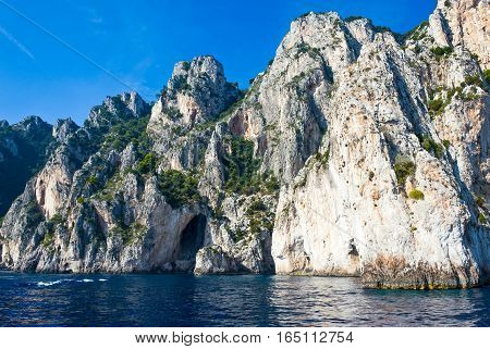 Italy Capri view from the sea of the south coast of the island near the Arco Naturale sea cave