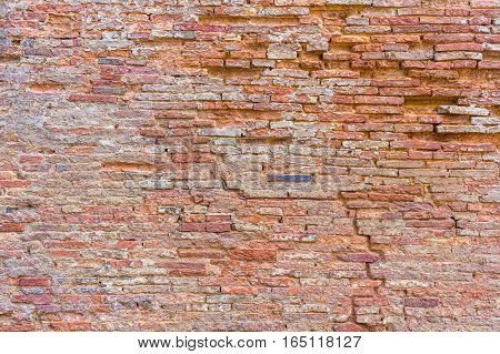 Weathered texture of stained old dark brown and red brick wall texture grunge background red brick wall background grungy rusty blocks of stone-work China brick
