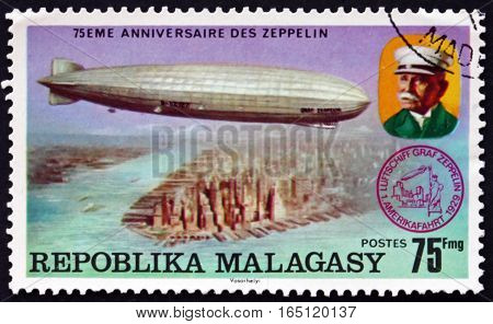 MALAGASY - CIRCA 1975: a stamp printed in Malagasy Madagascar shows Count Zeppelin and LZ-127 over New York City 75th Anniversary of the Zeppelin circa 1975
