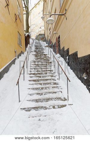 Steep snowy stairs a sunny winter day in central Stockholm Sweden
