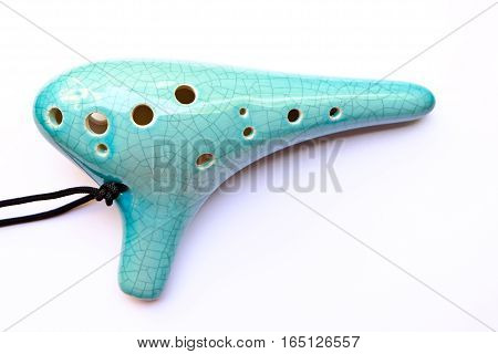 The blue Ocarina isolated on white background