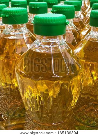 Closed up pile of bottled palm oil in the market