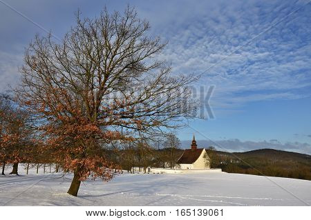 Winter landscape with a beautiful chapel near castle Veveri. Czech Republic city of Brno. The Chapel of the Mother of God.