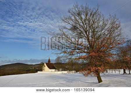 Winter landscape with a beautiful chapel near castle Veveri. Czech Republic city of Brno. The Chapel of the Mother of God.