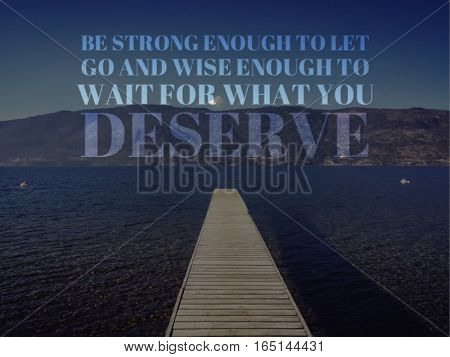 Inspirational quote on lake landscape with wooden pier in water on a bright sunny day.  Mountains and bright clear blue sky in background.  Lighting effects applied.