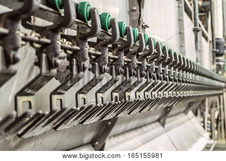 Suspended conveyor for hanging chickens. Limited depth of field.