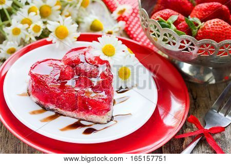 Strawberry heart cake dessert on Valentines Day classic Valentines Day heart-shaped cake with fresh strawberries in jelly gluten-free dessert