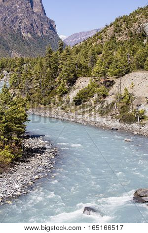 Beautiful mountain landscape in Himalayas Annapurna region Nepal. Sunny day of Nepal summer. Big mountain blue river and fresh air. Eco travel