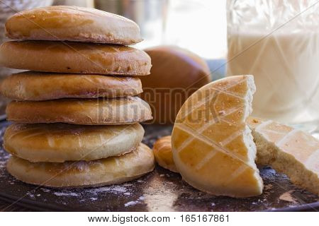 Two halves of a marshmallow on a wooden tray