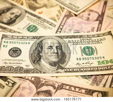 Pile of one hundred dollars bills background