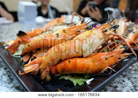 grill shrim seafood on black dish table