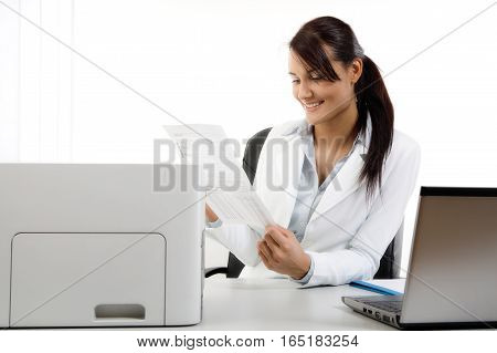 Attractive businesswoman working with laptop at the office. Business concept.
