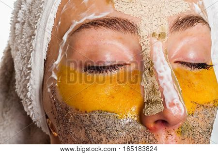 Woman with different masks on her face multi-masking
