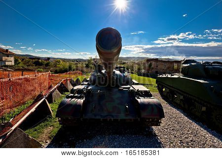 Military Tank Silhouette With Sun Rays