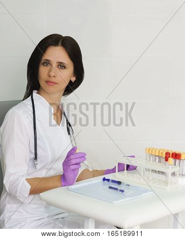 The physician assistant or doctor of clinical laboratory diagnostics or biologist diagnostic laboratory