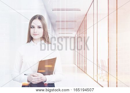 Young girl in an office suit is holding a black folder and standing in a white office corridor with conference rooms. 3d rendering. Mock up. Toned image. Double exposure